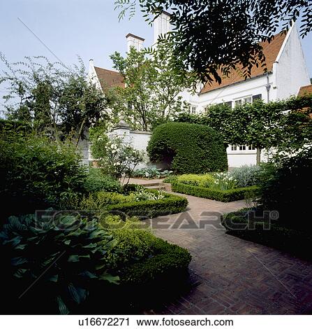 Low box hedges around beds in formal country garden with brick paving View Large Photo Image Stock Image - Low box hedges around beds in formal country garden with brick paving . Fotosearch