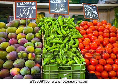 Mangoes with green chillies and tomatoes on Spanish market stall View Large Photo Image Stock Image - Mangoes with green chillies and tomatoes on Spanish market stall. Fotosearch