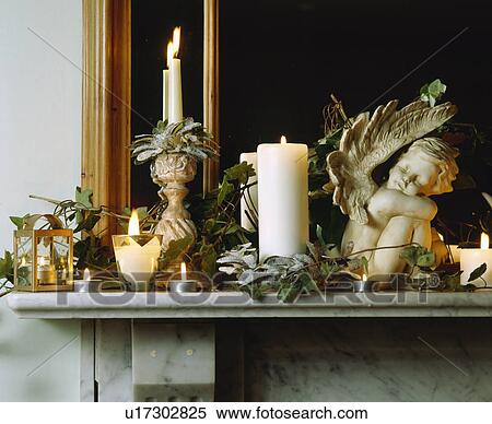 Mantlepiece decorated with candles, cherubs and ivy for Christmas. View Large Photo Image Stock Photography - Mantlepiece decorated with candles, cherubs and ivy for Christmas.. Fotosearch