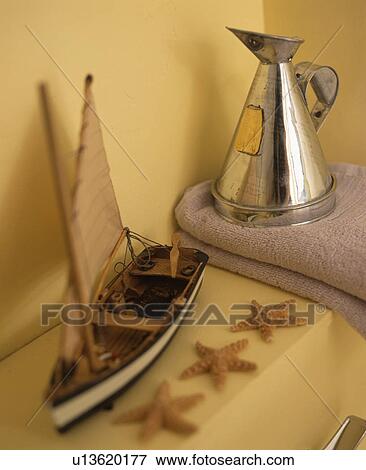model sailing boat on shelf in yellow painted bathroom View Large Photo Image Stock Photo - model sailing boat on shelf in yellow painted bathroom. Fotosearch