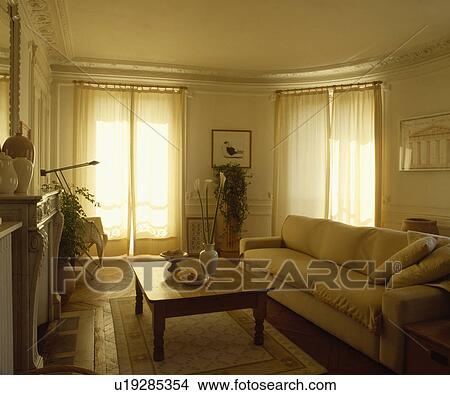 Modern cream sofa in traditional living room View Large Photo Image Picture - Modern cream sofa in traditional living room. Fotosearch