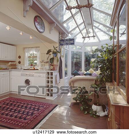 Modern kitchen with conservatory living room extension View Large Photo Image Stock Photo - Modern kitchen with conservatory living room extension. Fotosearch