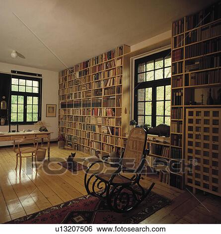 Modern study with stripped floor and ceiling to floor book shelving. View Large Photo Image Stock Photograph - Modern study with stripped floor and ceiling to floor book shelving.. Fotosearch