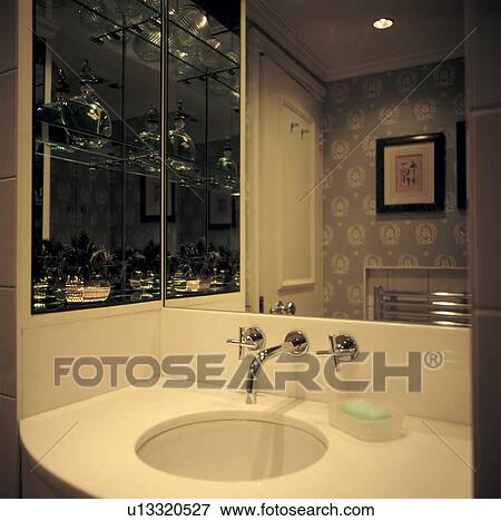 Stock Photo - Modern white basin with chrome taps. Fotosearch