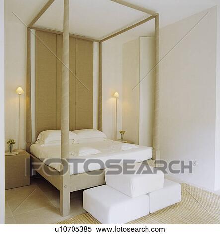 Modern white bedroom with a four-poster-bed View Large Photo Image Stock Photography - Modern white bedroom with a four-poster-bed. Fotosearch
