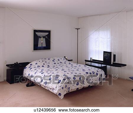 Modern white bedroom with black furniture View Large Photo Image Stock Photograph - Modern white bedroom with black furniture. Fotosearch