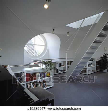 Stock Photo - Modern white loft conversion living room with grey carpet. Fotosearch