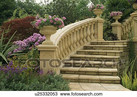 Stock Image - New stone steps and ballustrade in country garden in summer. Fotosearch