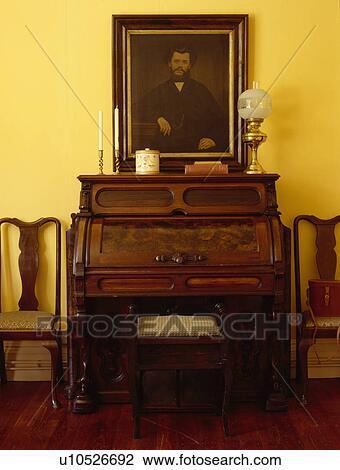 Stock Image - Oil portrait above old organ. Fotosearch