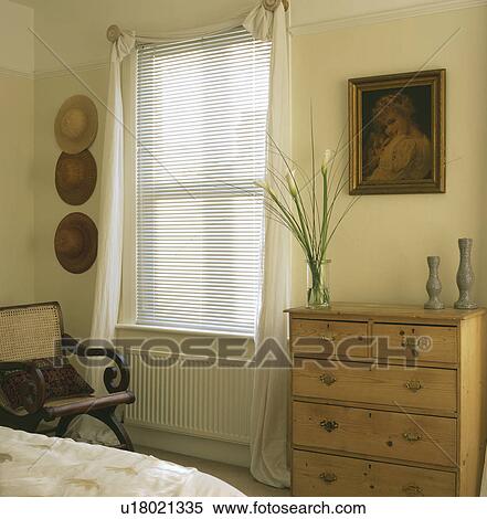 Old Pine Chest In Bedroom With Venetian Blind And Cream Curtains