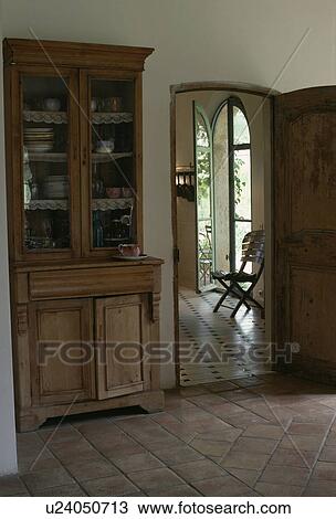 Old Pine Dresser With Glass Doors In Country Hall With Terracotta