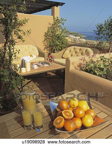 Oranges on table on veranda of villa in Southern Spain View Large Photo Image Stock Photo - Oranges on table on veranda of villa in Southern Spain. Fotosearch