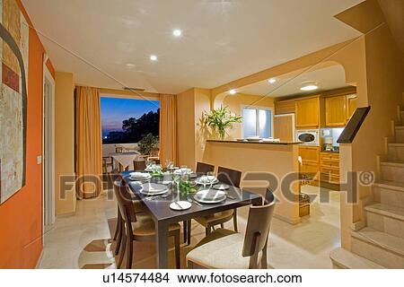 Pale orange openplan dining room and kitchen in modern apartment in Spain View Large Photo Image Picture - Pale orange openplan dining room and kitchen in modern apartment in Spain. Fotosearch