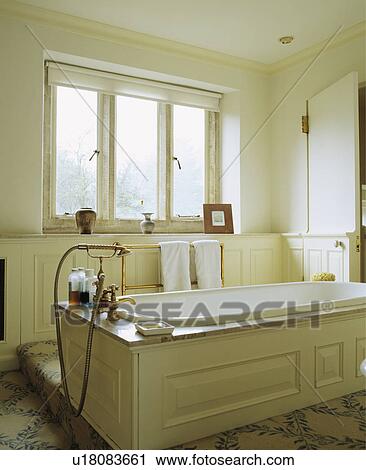 Panelled freestanding bath in traditional cream bathroom View Large Photo Image Stock Image - Panelled freestanding bath in traditional cream bathroom. Fotosearch