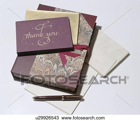 Stock Image - Papyrus old-fashioned writing set in marbled paper folder with fountain pen. Fotosearch
