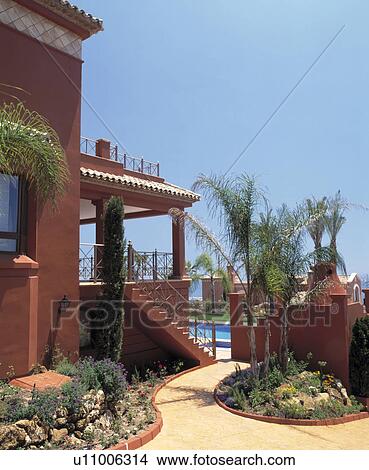 Path and small formal beds beside Spanish villa View Large Photo Image Picture - Path and small formal beds beside Spanish villa. Fotosearch
