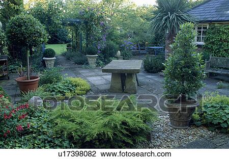 Patio in country garden in summer View Large Photo Image Stock Image - Patio in country garden in summer. Fotosearch
