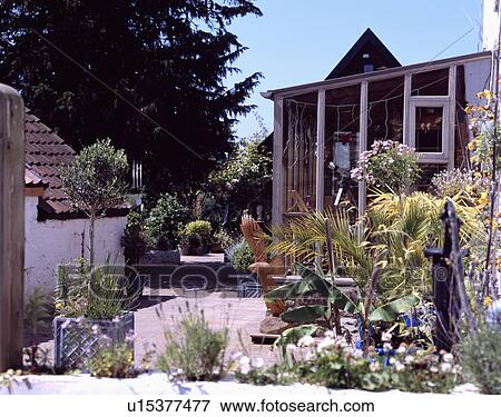 Stock Photo - Patio in country garden in summer. Fotosearch