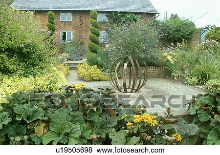 Stock Photo - Patio in country garden in summer. Fotosearch