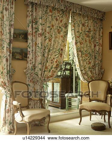 Patterned curtains in traditional living room View Large Photo Image Picture - Patterned curtains in traditional living room. Fotosearch