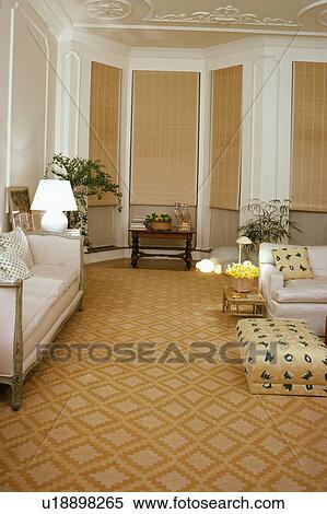 Patterned yellow carpet in traditional living room with split-cane blinds View Large Photo Image Stock Photography - Patterned yellow carpet in traditional living room with split-cane blinds. Fotosearch