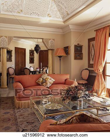 Peach sofa and curtains in living room with classical pillars View Large Photo Image Stock Image - Peach sofa and curtains in living room with classical pillars. Fotosearch