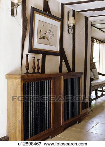 Stock Photo - Picture above covered radiator in beamed country hall. Fotosearch