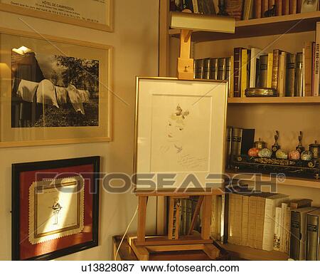 Stock Photo - Picture on easel in traditional living room. Fotosearch