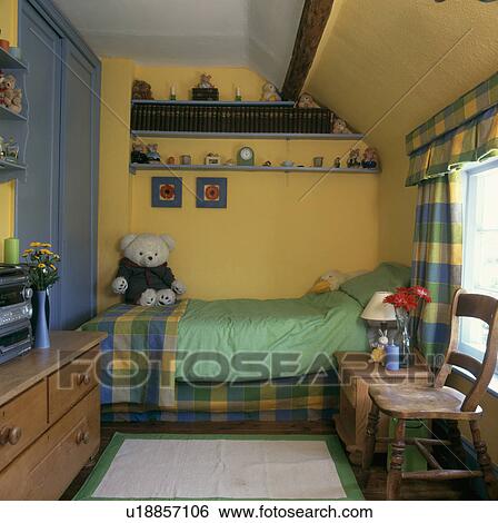 Pine furniture in child's yellow bedroom with yellow and blue checked linen and curtains View Large Photo Image Stock Photograph - Pine furniture in child's yellow bedroom with yellow and blue checked linen and curtains. Fotosearch