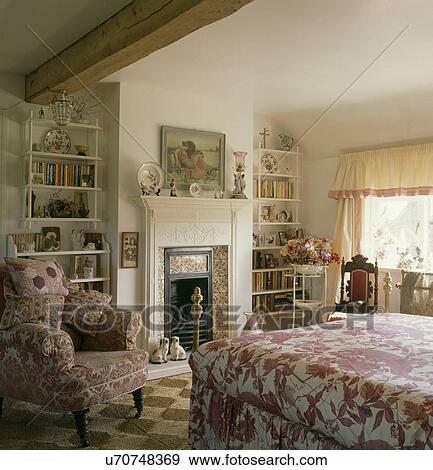 Pink White Bedlinen And Armchair In Cottage Bedroom With White