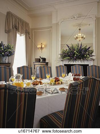 Place Settings On White Table Cloth In Traditional Restaurant