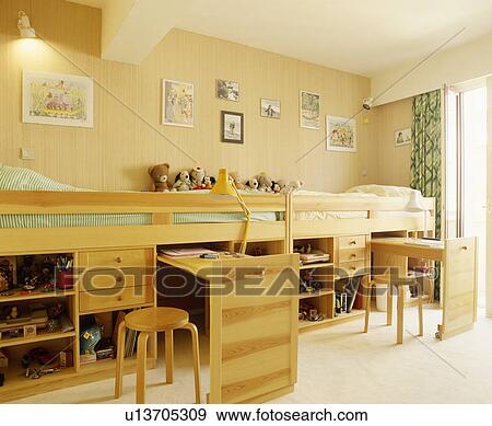 Platform beds with pull-out desks and storage below View Large Photo Image Stock Photo - Platform beds with pull-out desks and storage below. Fotosearch