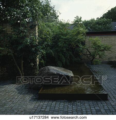 Pond and paving in town garden View Large Photo Image Picture - Pond and paving in town garden. Fotosearch
