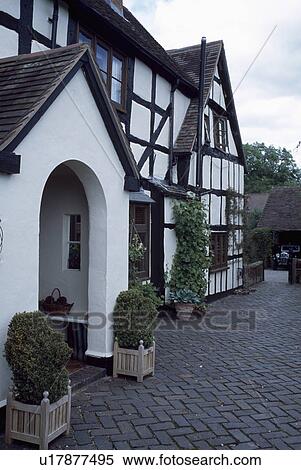 Stock Photography - Porch on traditional black+white house in the country. Fotosearch