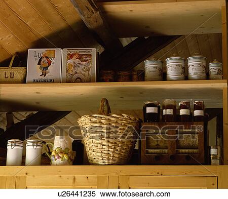 Pottery and glass jars on wooden shelves with basket View Large Photo Image Stock Photography - Pottery and glass jars on wooden shelves with basket. Fotosearch
