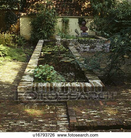 Rectangular pond in formal garden in summer View Large Photo Image Stock Photograph - Rectangular pond in formal garden in summer. Fotosearch