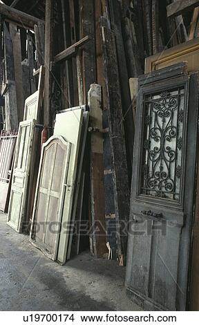 Recycling materials such as doors and windows. View Large Photo Image Picture - Recycling materials such as doors and windows.. Fotosearch