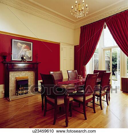 Red Curtains And Wooden Flooring In Dining Room With Fireplace Red Curtains And Wooden Flooring In