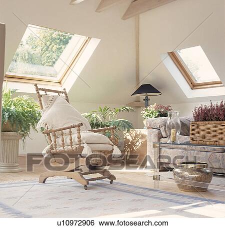 Rockingchair in white attic conversion living room with Velux windows View Large Photo Image Stock Photograph - Rockingchair in white attic conversion living room with Velux windows. Fotosearch