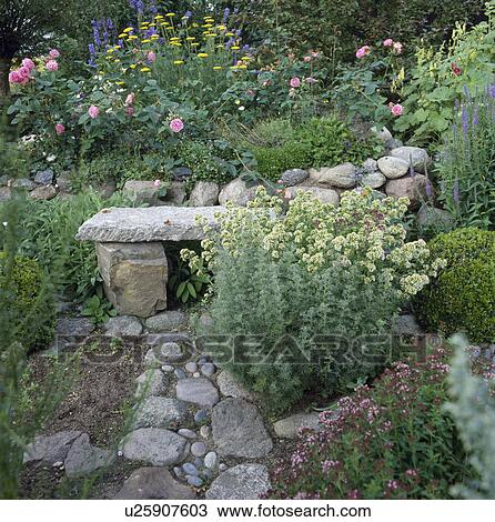 Rustic stone bench in country garden in summer View Large Photo Image Stock Image - Rustic stone bench in country garden in summer. Fotosearch