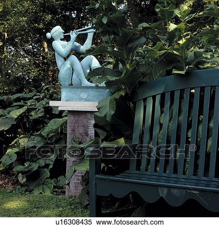 Stock Photography - Sculpture on plinth in country garden. Fotosearch