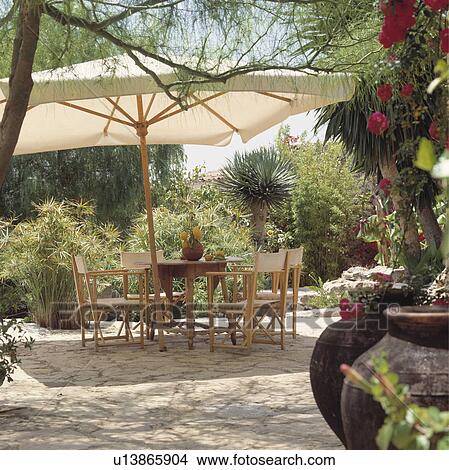 Seating and furniture on patio of Spanish villa View Large Photo Image Picture - Seating and furniture on patio of Spanish villa. Fotosearch