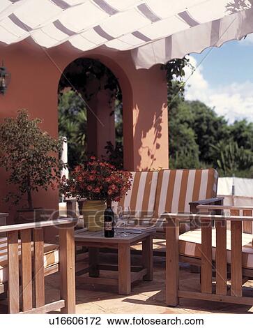 Seating and furniture on patio of Spanish villa View Large Photo Image Stock Image - Seating and furniture on patio of Spanish villa. Fotosearch
