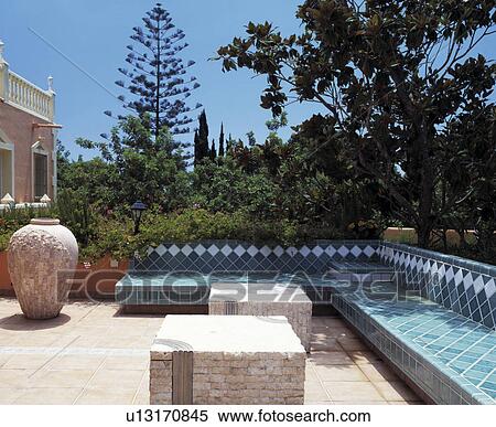 Seating and furniture on patio of Spanish villa View Large Photo Image Stock Photography - Seating and furniture on patio of Spanish villa. Fotosearch