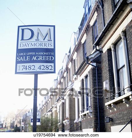 Picture - Sign Agreed sign board outside terraced houses. Fotosearch