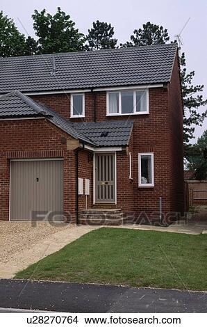 Small eighties house with drive and garage View Large Photo Image Picture - Small eighties house with drive and garage. Fotosearch