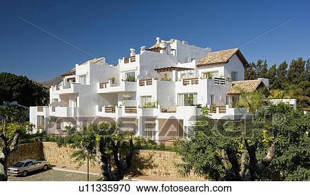 Small modern apartment building with balconies in Southern Spain View Large Photo Image Stock Image - Small modern apartment building with balconies in Southern Spain. Fotosearch