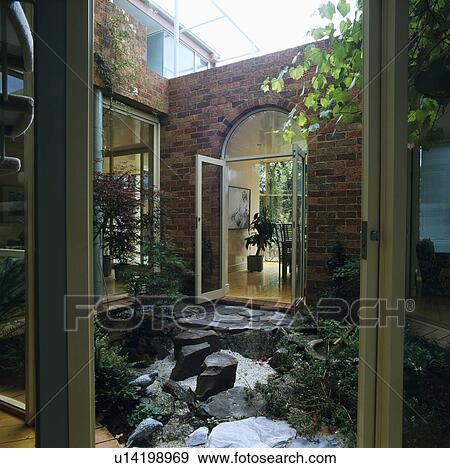 Stock Photo - Small modern courtyard garden. Fotosearch