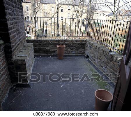 Stock Image - Small town roof garden before renovation. Fotosearch