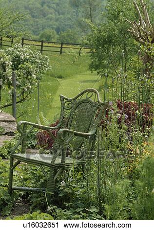 Small wooden chair in country garden in summer View Large Photo Image Stock Image - Small wooden chair in country garden in summer. Fotosearch